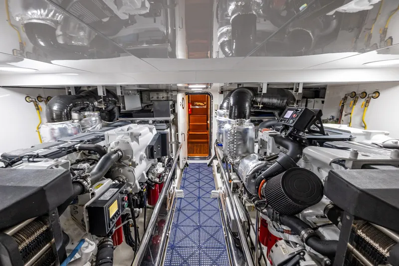 Slide: The Image of Engine room of 2017 Ocean Alexander 72 Pilothouse yacht, featuring advanced machinery and equipment. - 73