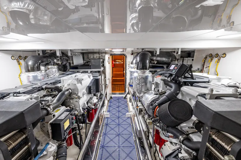 Slide: The Image of Engine room of 2017 Ocean Alexander 72 Pilothouse yacht, showcasing advanced machinery and equipment. - 75