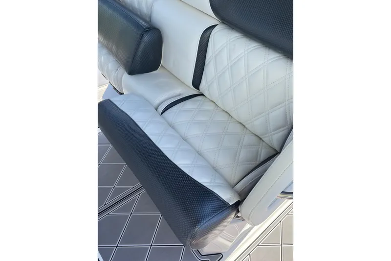 Slide: The Image of Luxurious seating on 2019 Nor-Tech 390 Sport Center Console with diamond-pattern upholstery. - 7