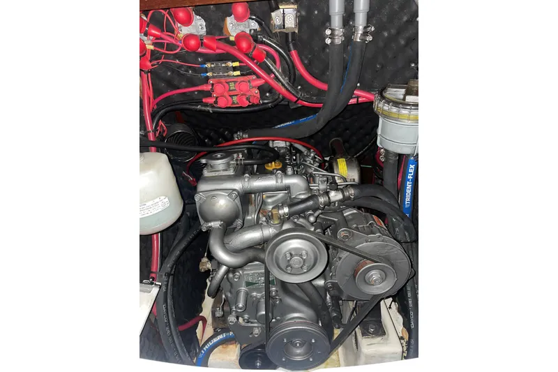 Slide: The Image of Engine compartment of a 2003 Beneteau 361 sailboat, featuring detailed wiring and components. - 11