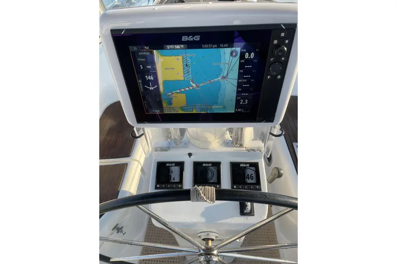 Slide: The Image of Steering console of 2003 Beneteau 361 sailboat with navigation display. - 12