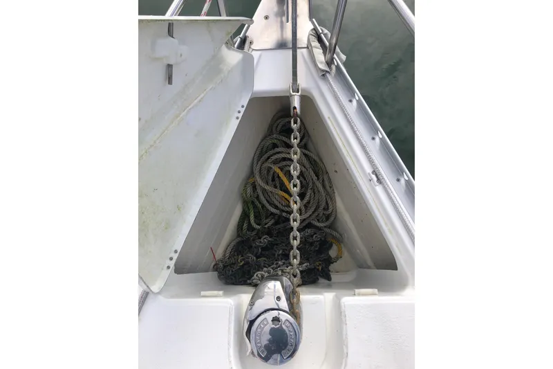 Slide: The Image of Anchor chain and ropes on a 2003 Beneteau 361 sailboat deck. - 13