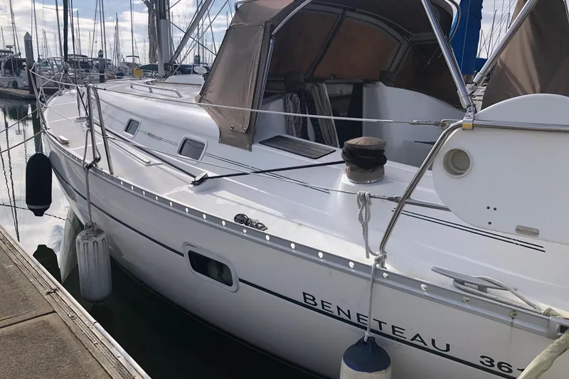 Slide: The Image of 2003 Beneteau 361 sailboat docked at marina, side view. - 19