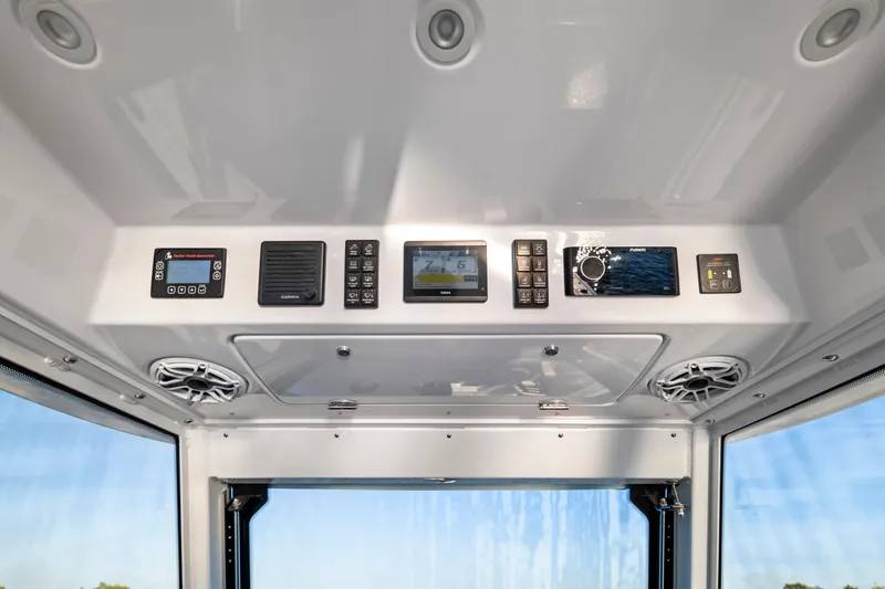 Slide: The Image of 2026 Everglades 375 Center Console dashboard with modern navigation and control systems. - 13