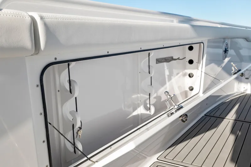 Slide: The Image of 2026 Everglades 375 Center Console boat interior with storage compartment and sleek design. - 15
