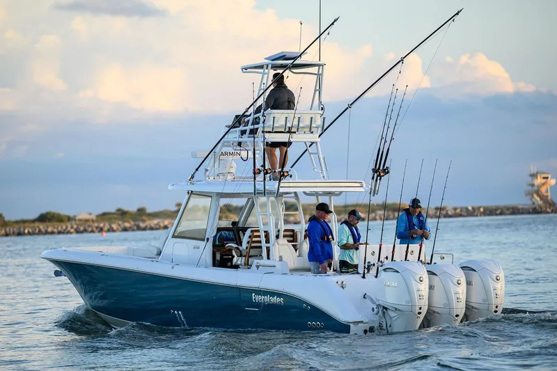 Slide: The Image of Manufacturer Provided Image: 2025 Everglades 375 Center Console boat with fishing gear on open water. - 3