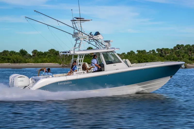 Slide: The Image of Manufacturer Provided Image: 2025 Everglades 375 Center Console boat cruising on water, side view. - 4