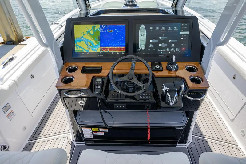 Slide: The Image of Manufacturer Provided Image: 2025 Everglades 375 Center Console boat dashboard with advanced navigation displays. - 5