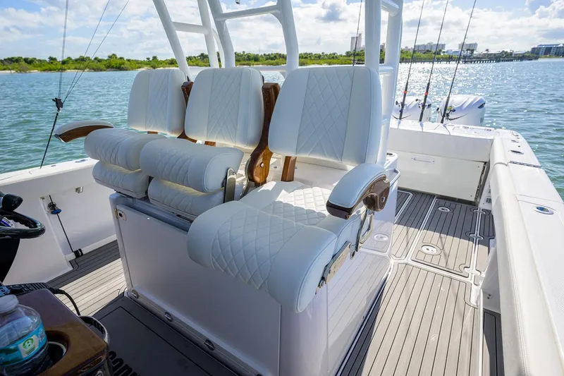 Slide: The Image of Manufacturer Provided Image: 2025 Everglades 375 Center Console boat with luxurious seating on open water. - 7