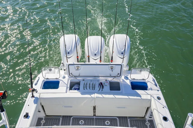 Slide: The Image of Manufacturer Provided Image: 2025 Everglades 375 Center Console boat with fishing rods and outboard motors. - 8