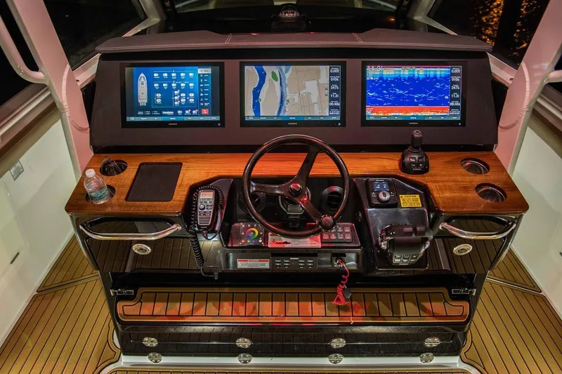 Slide: The Image of Manufacturer Provided Image: 2025 Everglades 395 Center Console helm with advanced navigation displays and controls. - 7