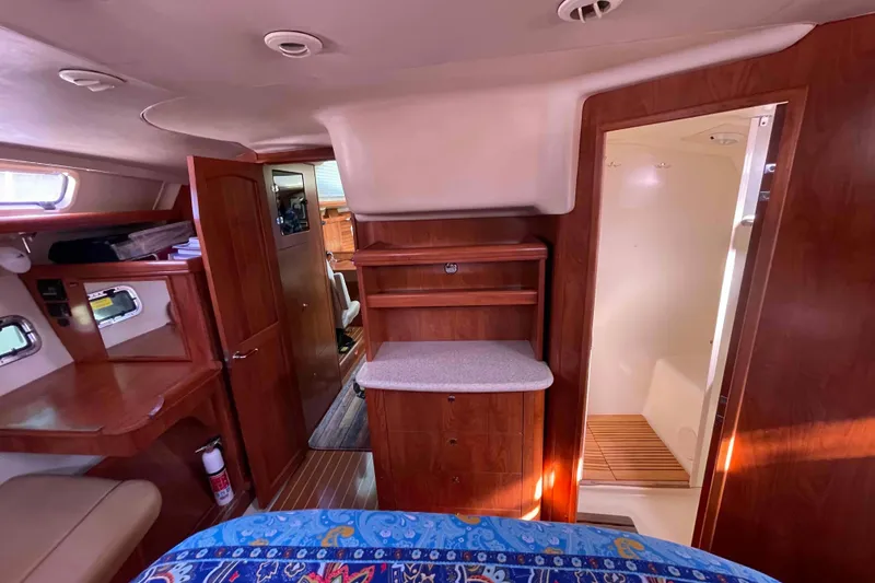 Slide: The Image of Luxurious cabin interior of 2010 Hunter 45 Center Cockpit with vibrant bedding. - 15