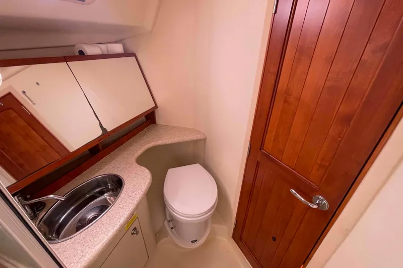 Slide: The Image of Interior of 2010 Hunter 45 Center Cockpit yacht with wood cabinetry and cozy design. - 17