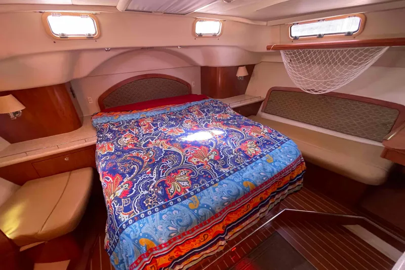 Slide: The Image of 2010 Hunter 45 Center Cockpit bathroom with shower, sink, and mirror. - 18