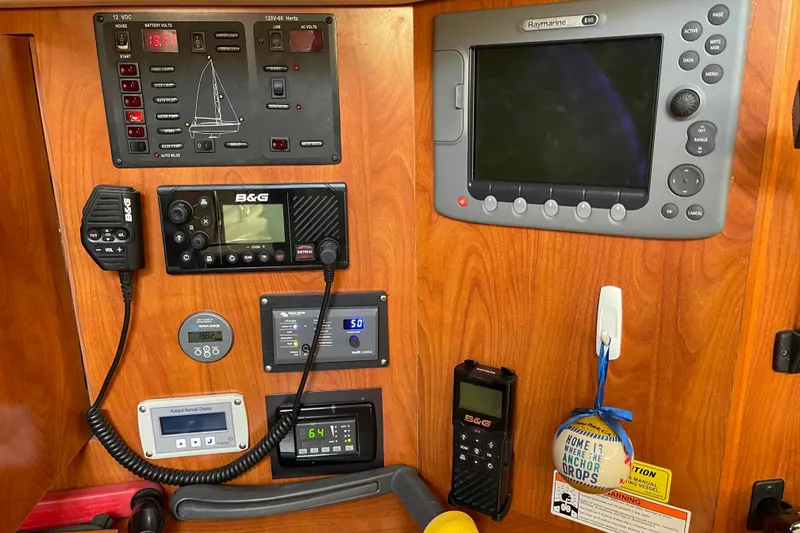 Slide: The Image of Luxurious 2010 Hunter 45 Center Cockpit interior with navigation station and plush seating. - 27