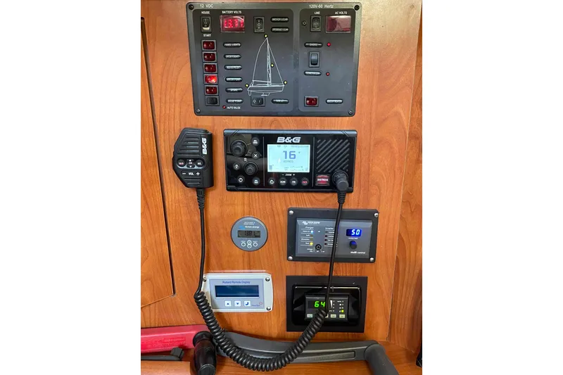 Slide: The Image of Control panel of a 2010 Hunter 45 Center Cockpit sailboat with navigation equipment. - 29