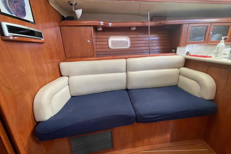 Slide: The Image of Electrical panel of a 2010 Hunter 45 Center Cockpit sailboat, featuring circuit protection switches. - 32