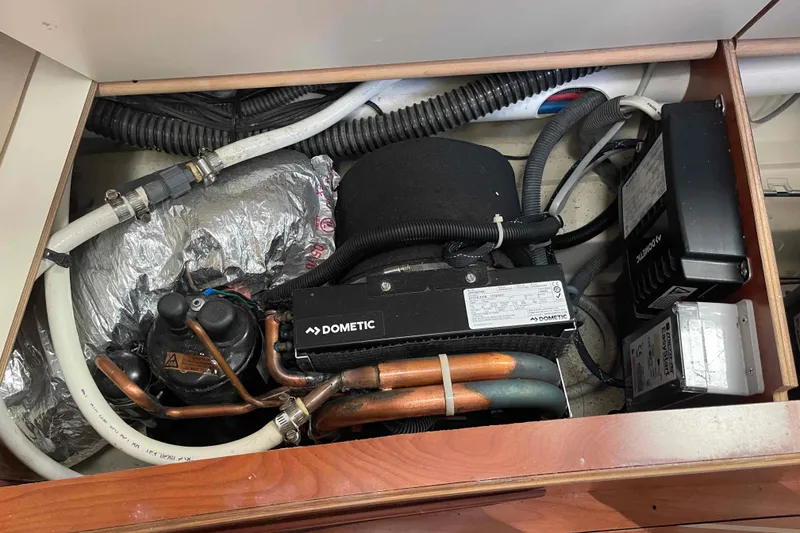 Slide: The Image of Interior of 2010 Hunter 45 Center Cockpit yacht with cozy seating and wooden cabinetry. - 34