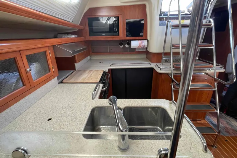 Slide: The Image of Luxurious interior of 2010 Hunter 45 Center Cockpit yacht with wood finish and modern amenities. - 4