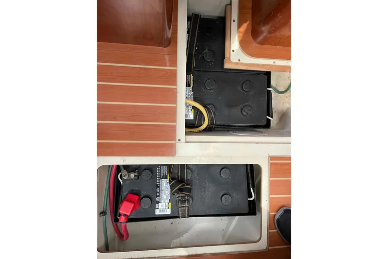 Slide: The Image of Smartphone displaying battery status app inside 2010 Hunter 45 Center Cockpit yacht interior. - 45
