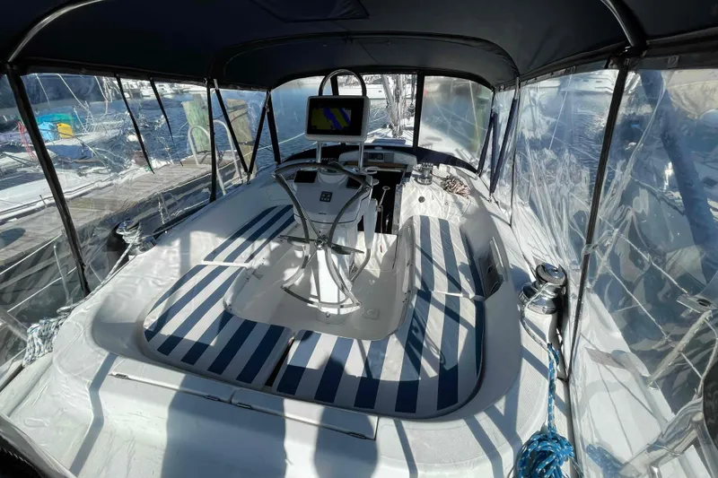 Slide: The Image of Battery compartment of 2010 Hunter 45 Center Cockpit sailboat with wooden flooring. - 47