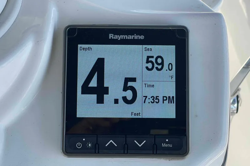 Slide: The Image of 2010 Hunter 45 Center Cockpit sailboat docked, featuring a covered cockpit and sleek design. - 51