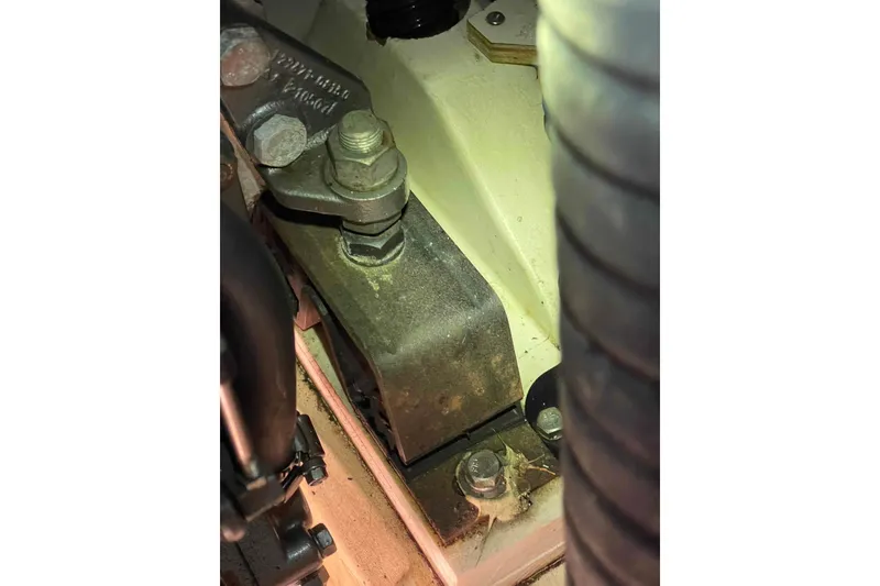 Slide: The Image of Bilge area of 2010 Hunter 45 Center Cockpit sailboat with hoses and fittings. - 60