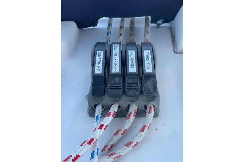 Slide: The Image of Engine component of a 2010 Hunter 45 Center Cockpit sailboat, showing alternator and wiring. - 68