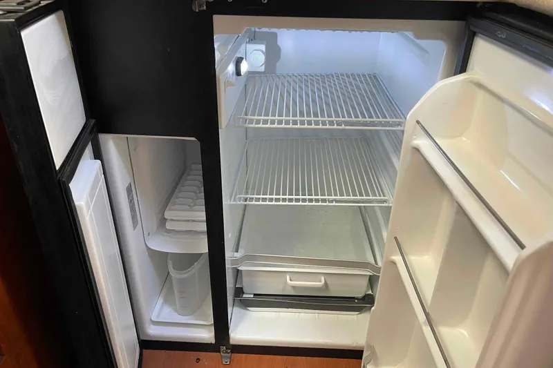 Slide: The Image of Galley sink in 2010 Hunter 45 Center Cockpit yacht, featuring dual basins and faucet. - 7