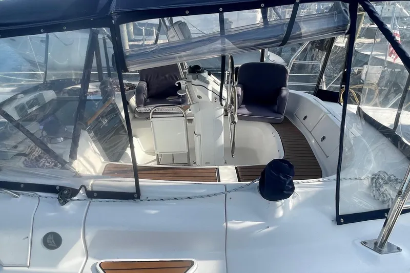 Slide: The Image of 2010 Hunter 45 Center Cockpit sailboat with spacious seating and steering wheel. - 91