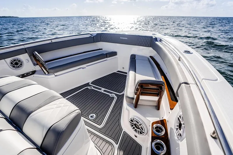 Slide: The Image of Manufacturer Provided Image: 2025 Everglades 455 Center Console boat interior with luxurious seating and ocean view. - 3