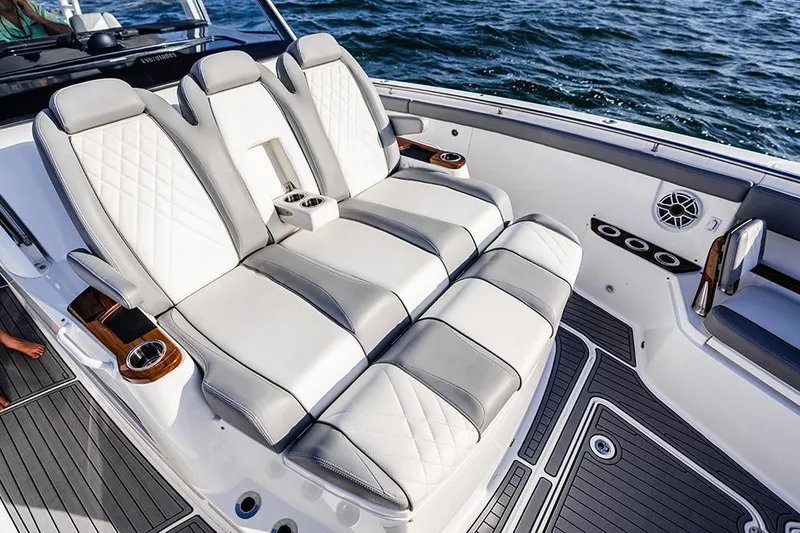 Slide: The Image of Manufacturer Provided Image: Luxurious seating on 2025 Everglades 455 Center Console boat, featuring elegant design and ocean backdrop. - 5