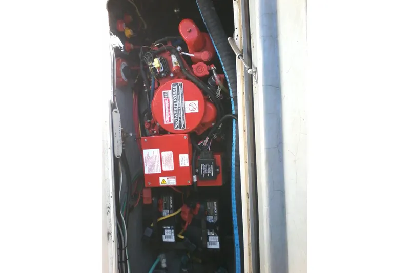 Slide: The Image of Twin Evinrude outboard engines on a 2002 Albemarle 265 Express Fisherman boat. - 11