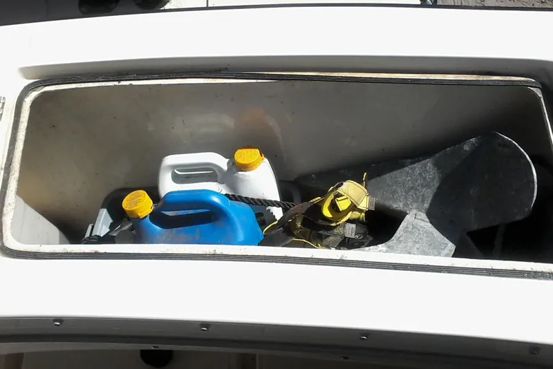 Slide: The Image of 2002 Albemarle 265 Express Fisherman boat on trailer, parked in wooded area. - 12