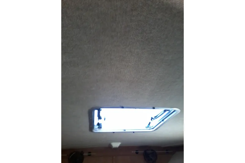 Slide: The Image of Engine compartment of 2002 Albemarle 265 Express Fisherman boat with visible wiring and components. - 17