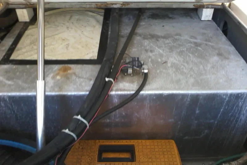 Slide: The Image of 2002 Albemarle 265 Express Fisherman boat interior with wiring and metal components. - 23