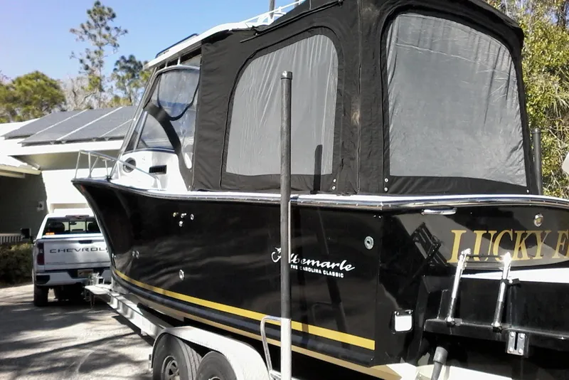 Slide: The Image of 2002 Albemarle 265 Express Fisherman boat with Evinrude engine, named "Lucky Fin." - 8