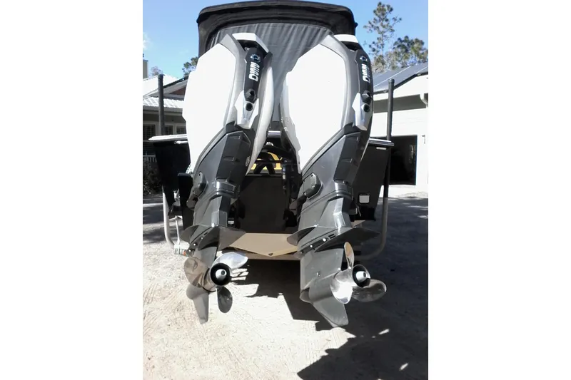 Slide: The Image of 2002 Albemarle 265 Express Fisherman boat on trailer, parked near a Chevrolet truck. - 9