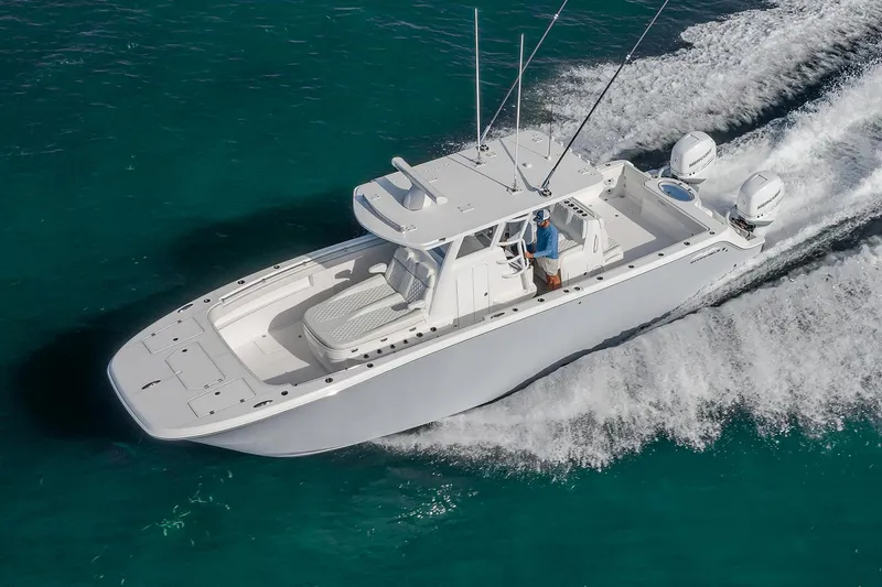 The Image of Manufacturer Provided Image: 2026 Invincible 33 Catamaran cruising on clear turquoise water. - 0
