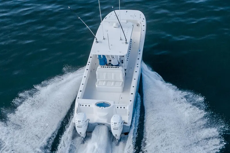 Slide: The Image of Manufacturer Provided Image: 2026 Invincible 33 Catamaran cruising on open water, showcasing powerful twin engines. - 2