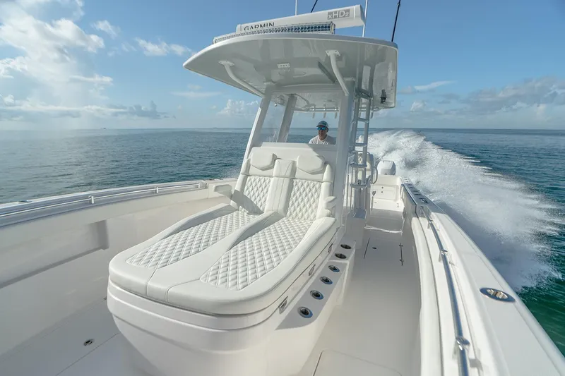 Slide: The Image of Manufacturer Provided Image: 2026 Invincible 33 Catamaran cruising on open water, featuring luxurious seating and sleek design. - 6