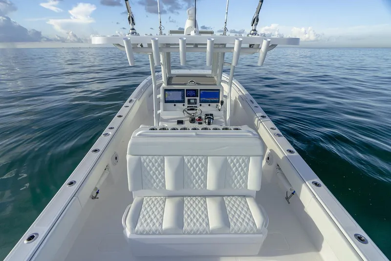 Slide: The Image of Manufacturer Provided Image: 2026 Invincible 33 Catamaran on calm ocean, featuring sleek design and advanced navigation systems. - 7