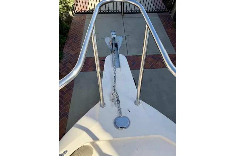 Slide: The Image of Bow view of 2015 Defiance 220 Admiral EX boat with anchor chain and railing. - 12