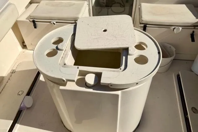 Slide: The Image of 2015 Defiance 220 Admiral EX boat interior with storage compartments and seating. - 19