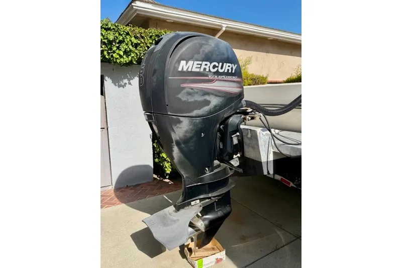 Slide: The Image of Mercury FourStroke outboard motor on 2015 Defiance 220 Admiral EX boat. - 21