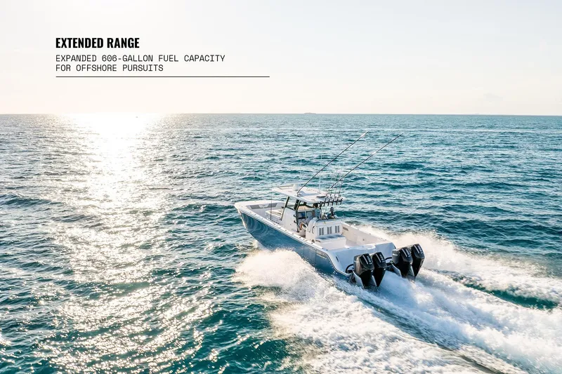 Slide: The Image of 2026 Invincible 36 Catamaran cruising offshore, showcasing extended range with 606-gallon fuel capacity. - 7