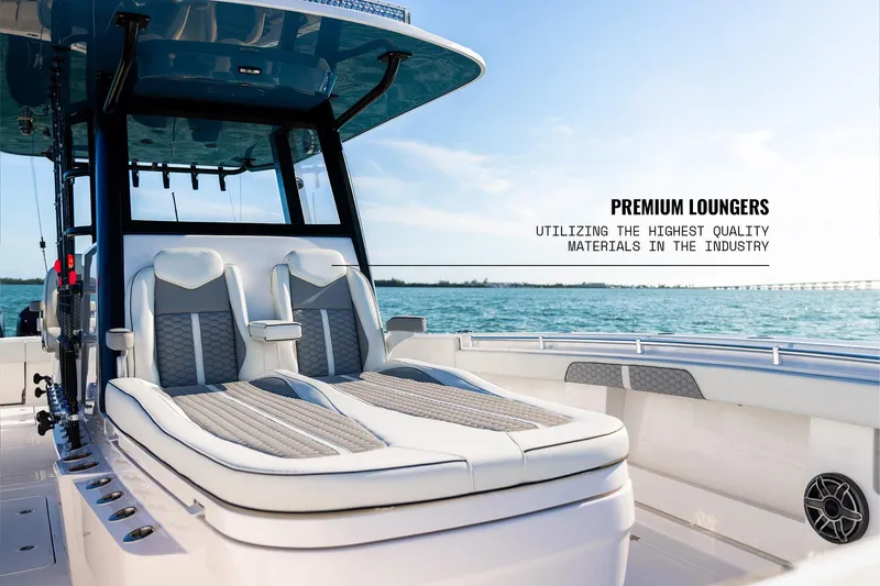 Slide: The Image of 2026 Invincible 36 Catamaran with premium loungers on a sunny day at sea. - 9