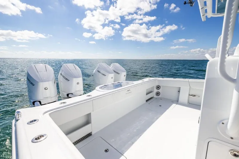 Slide: The Image of 2026 Invincible 38 Catamaran with four outboard engines on open sea. - 21