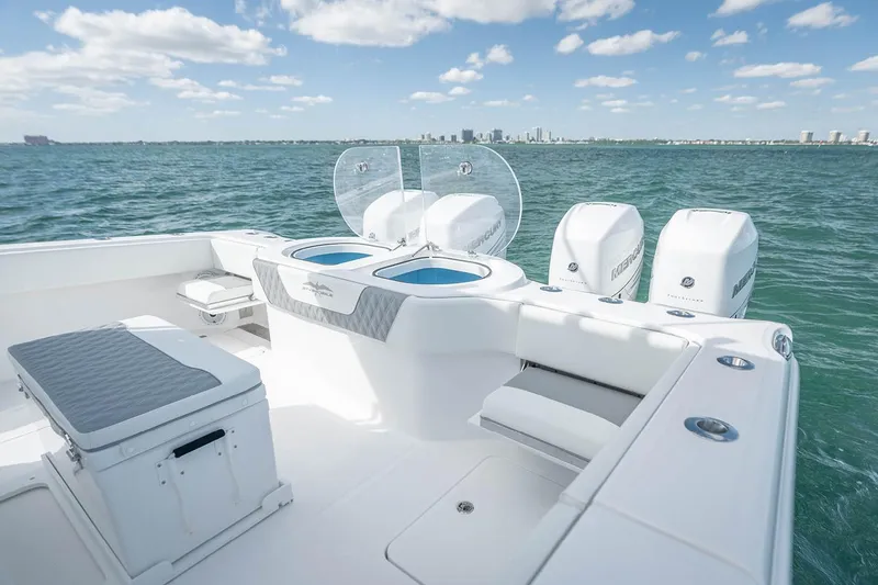 Slide: The Image of Manufacturer Provided Image: 2026 Invincible 40 Catamaran on water, featuring spacious deck and triple outboard engines. - 4