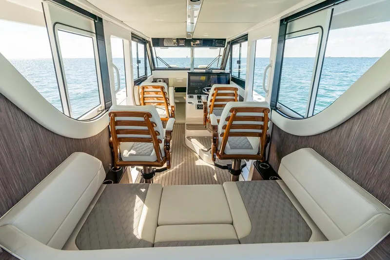 Slide: The Image of Manufacturer Provided Image: Luxurious interior of 2026 Invincible 46 Pilothouse yacht with ocean view. - 7